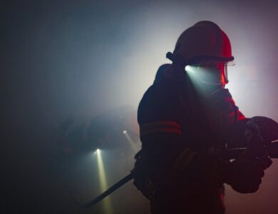 Photo of a Firefighter Holding a Hose