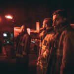 three fire fighters looking back