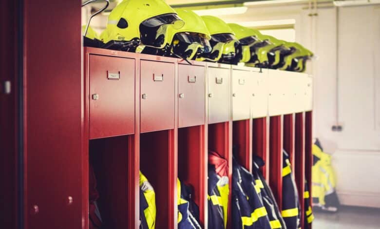a row of lockers with helmets on top of them