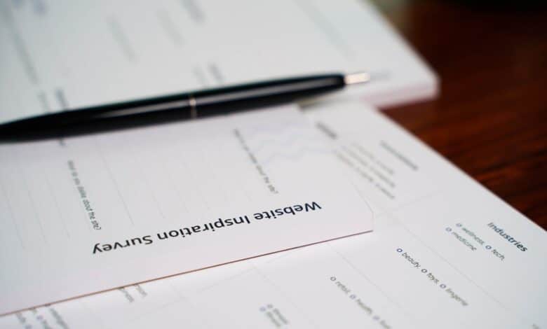 a pen sitting on top of a piece of paper